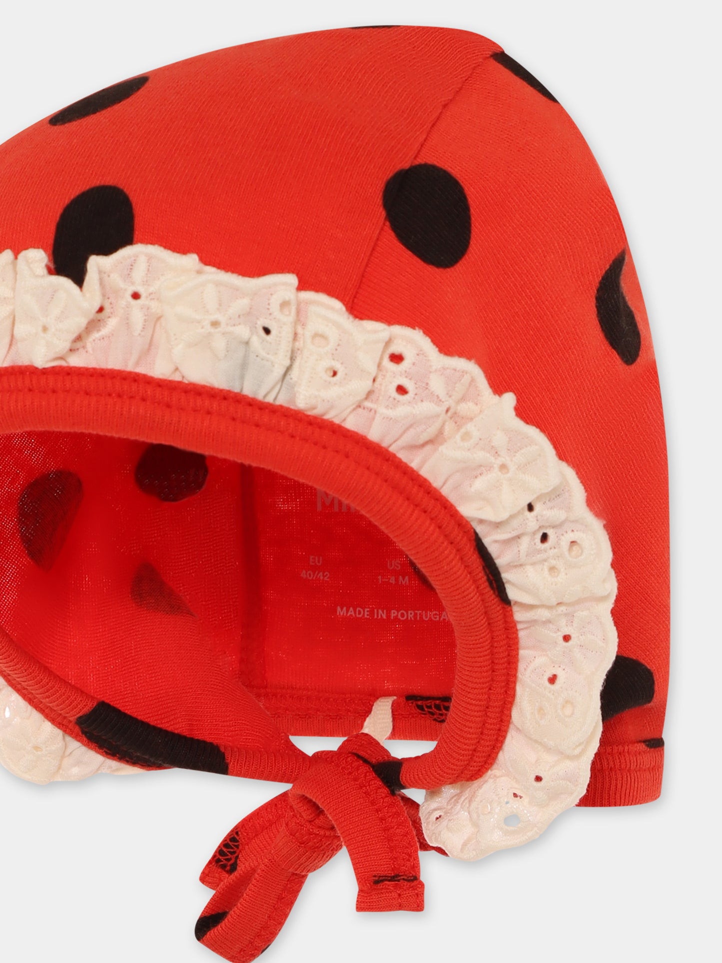 Cuffia rossa per neonata con pois