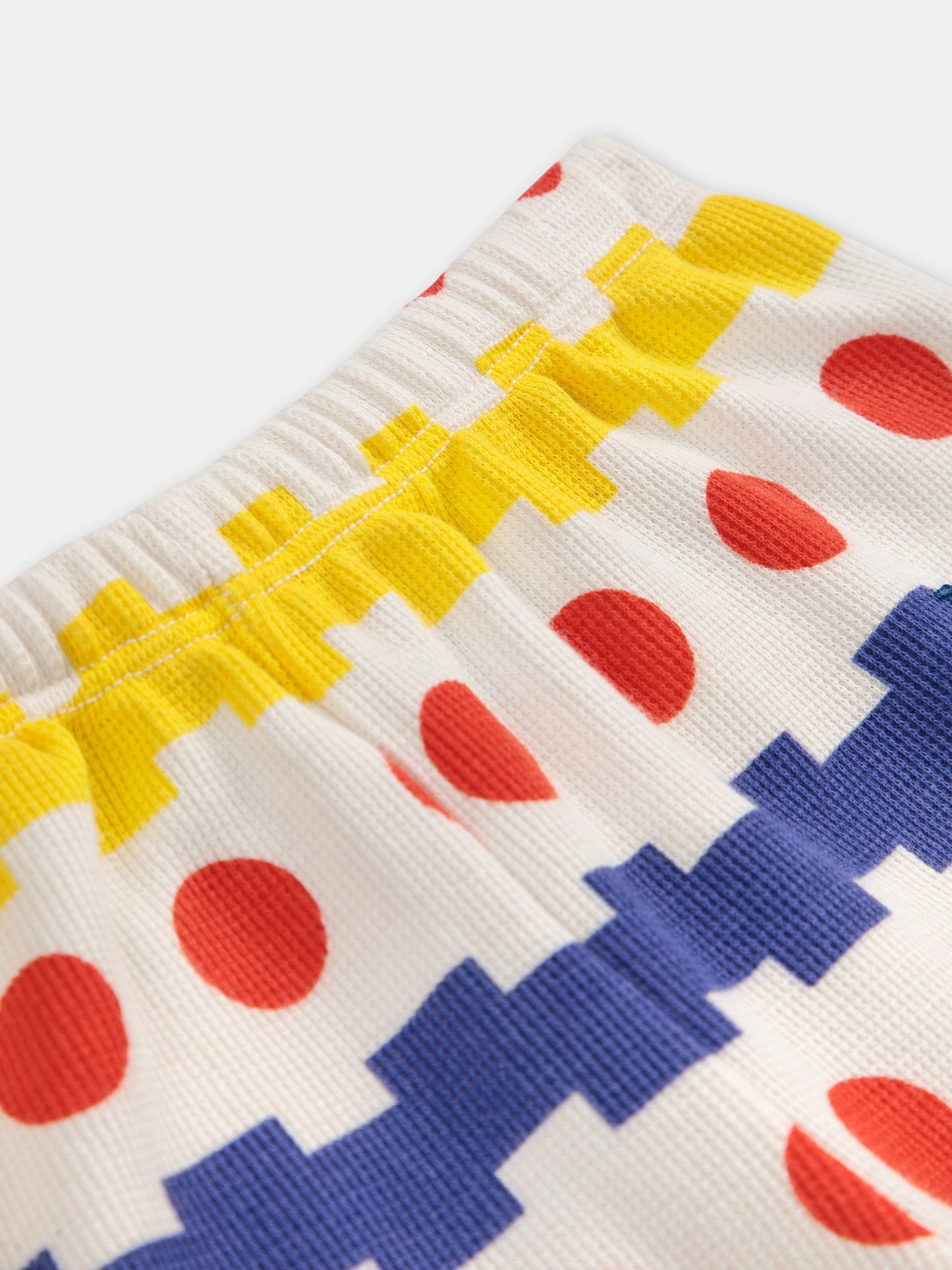 Pantaloni bianchi per neonati con stampa geometrica all over