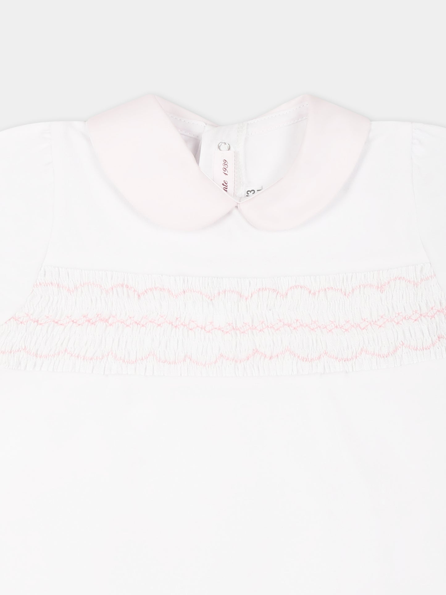 Pagliaccetto bianco per neonata con ricami