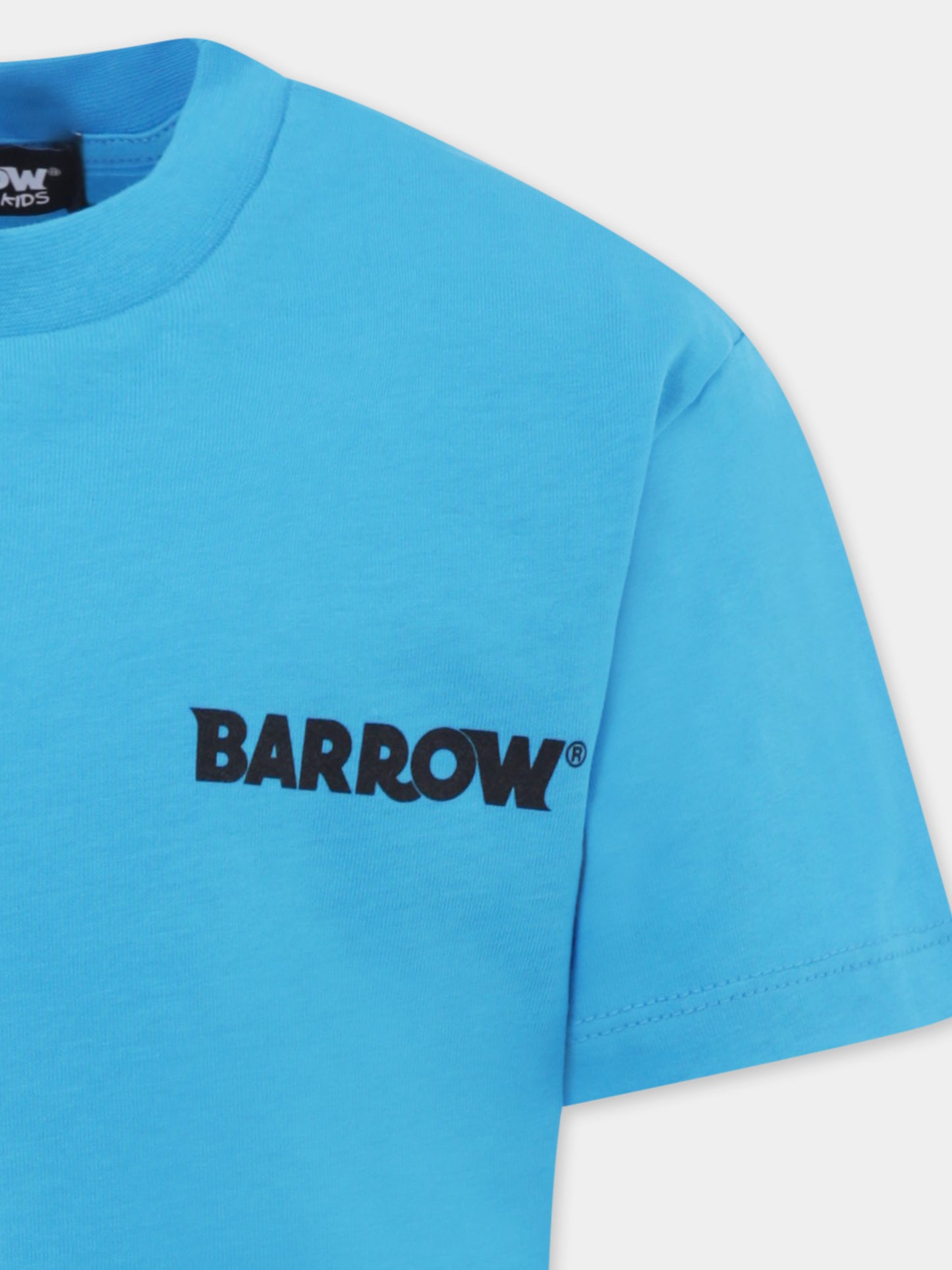 T-shirt azzurra per bambini con smile e palma