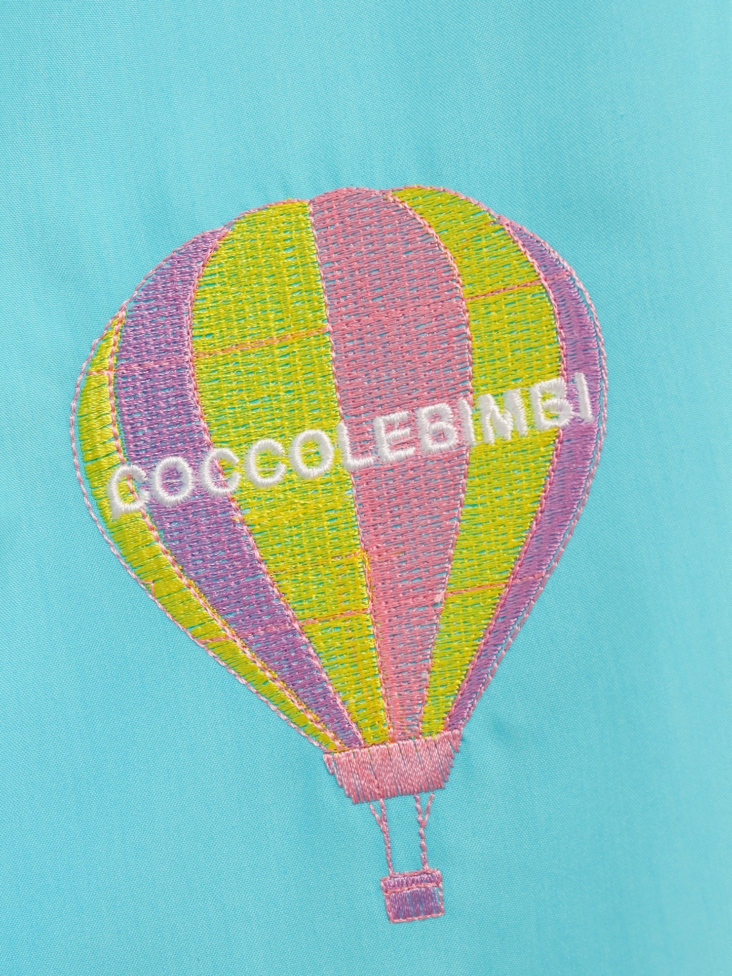 Vestito azzurro per bambina con nuvole e mongolfiera