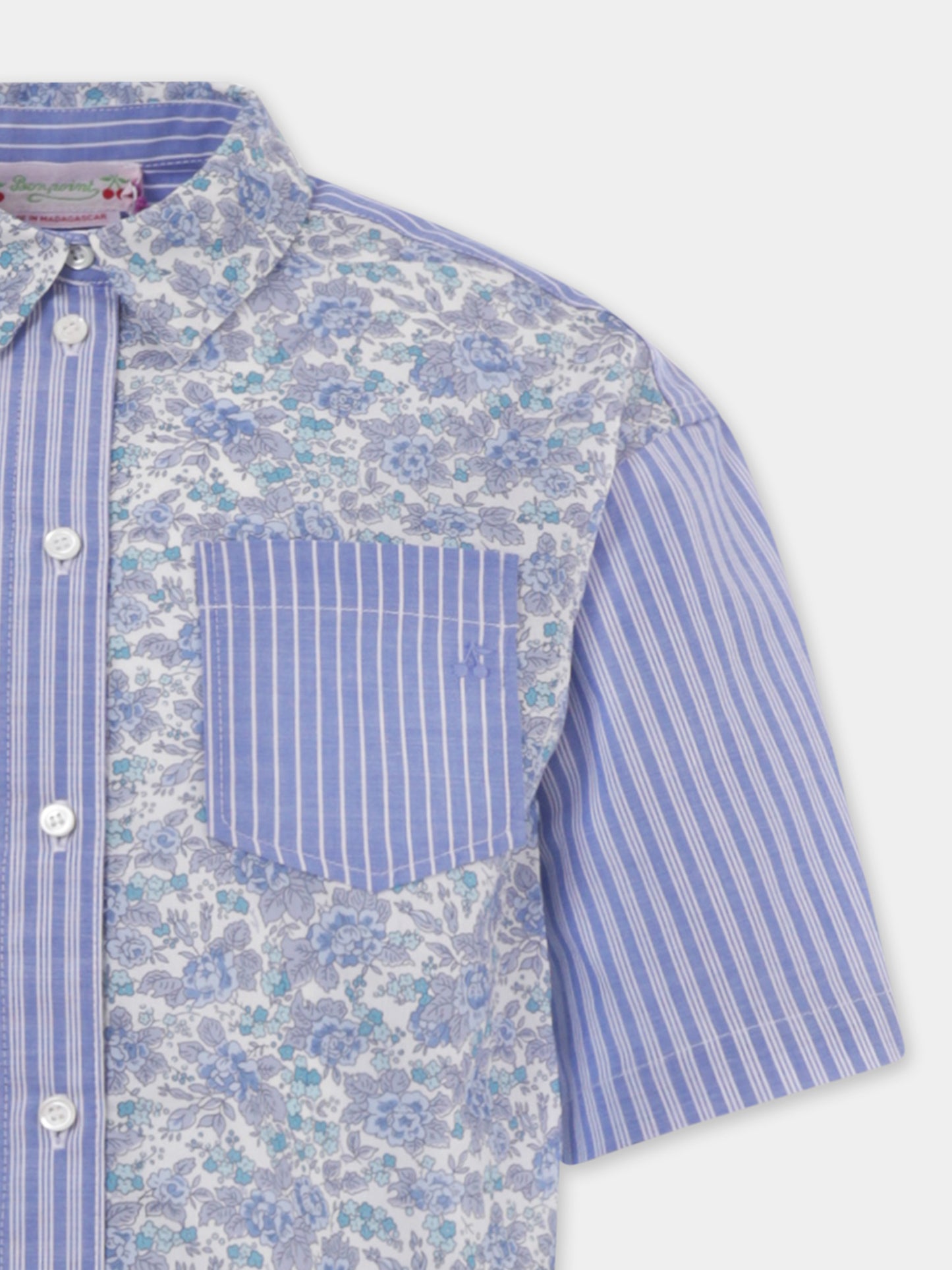 Camicia celeste per bambina con stampa floreale